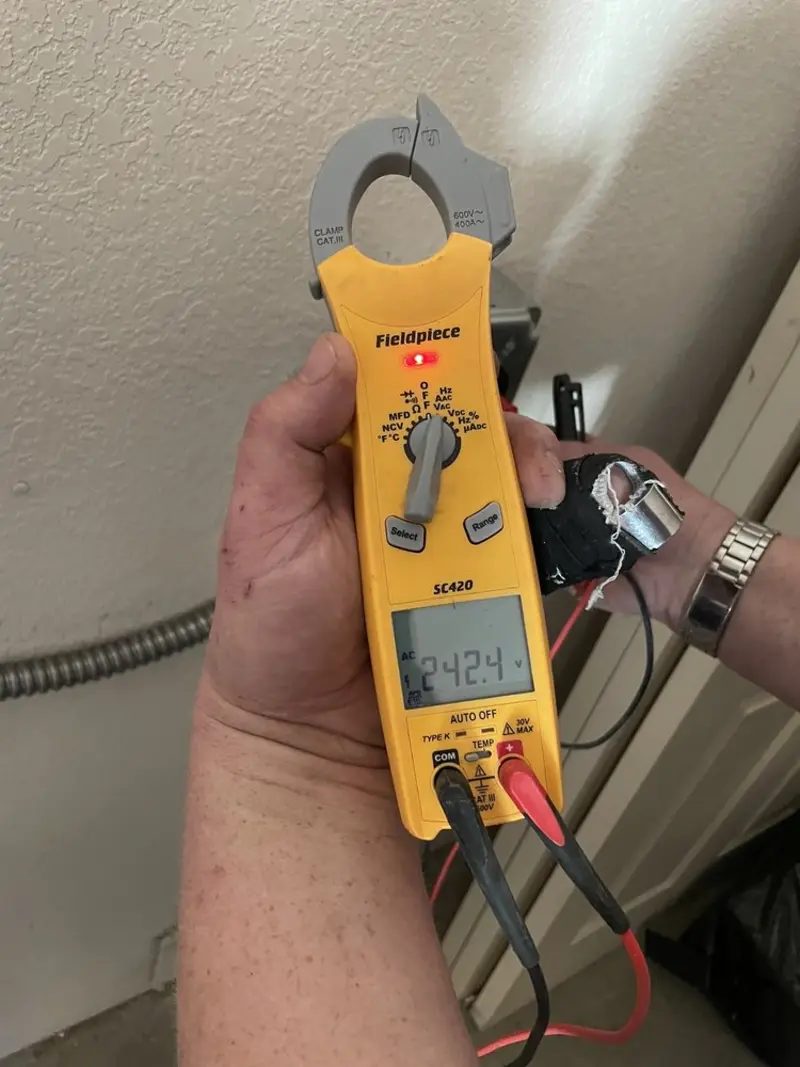 Voltage testing with clamp meter during Outlet Installation in Wheeling